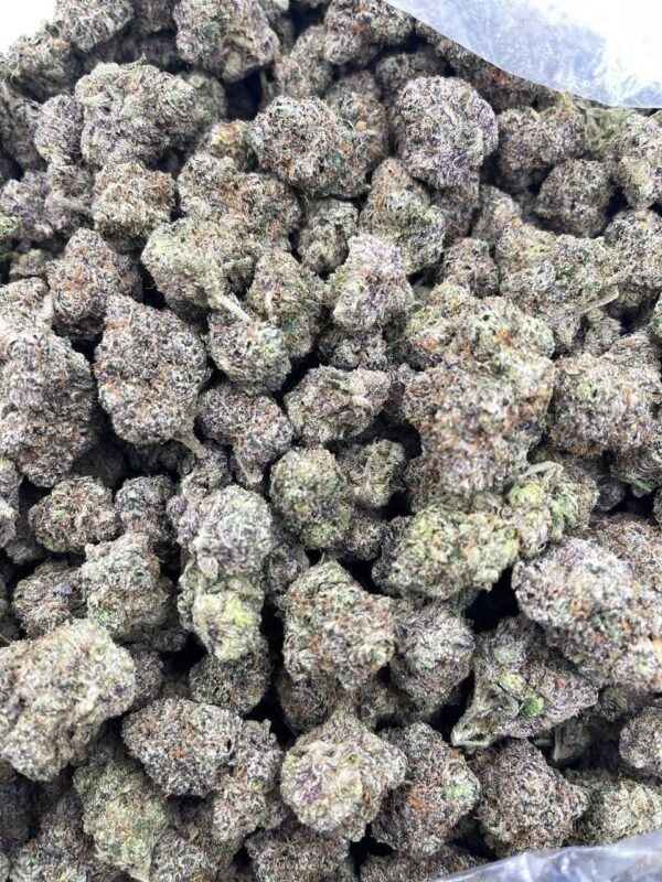 Super Sour Skunk THCa Flower premium cannabis buds featuring bright green hues with orange pistils